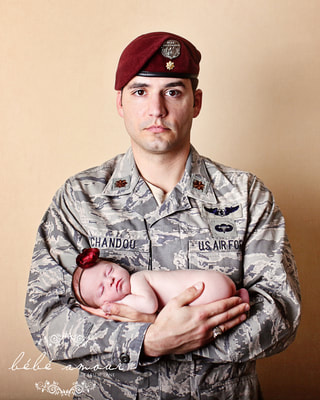 Military baby boy asleep in soldier arms by bebe amour leslie lane