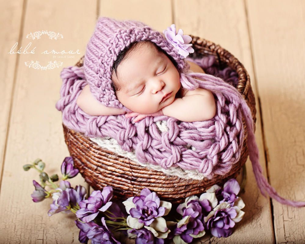 sleeping newborn purple flower basket